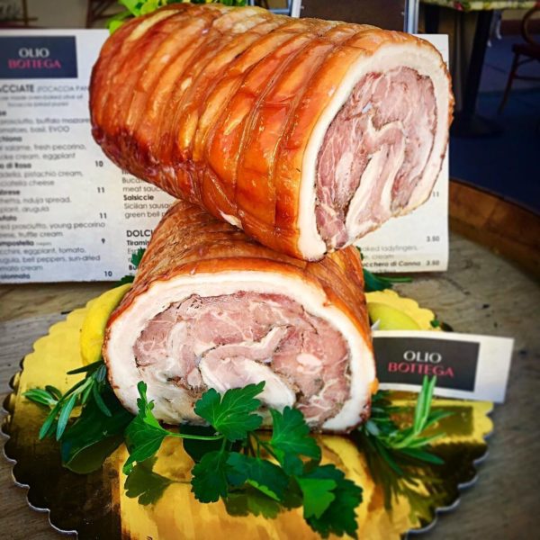 This rich pork belly roast has all the intense garlic and herb flavors of Roman porchetta, served on our house-made Focaccia bread with melted Pecorino cheese, green bell peppers, and a lemon-Dijon mustard